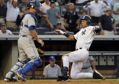Jeter slides in to complete his inside-the-park home run on July 22